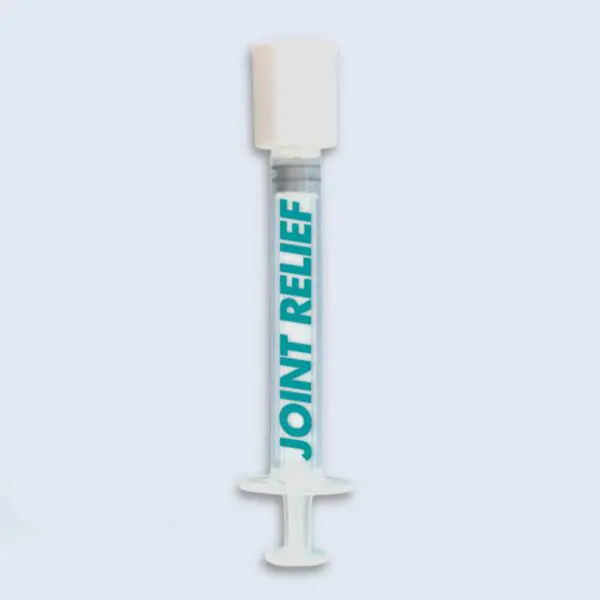 A white tube of joint relief is sitting on the floor.